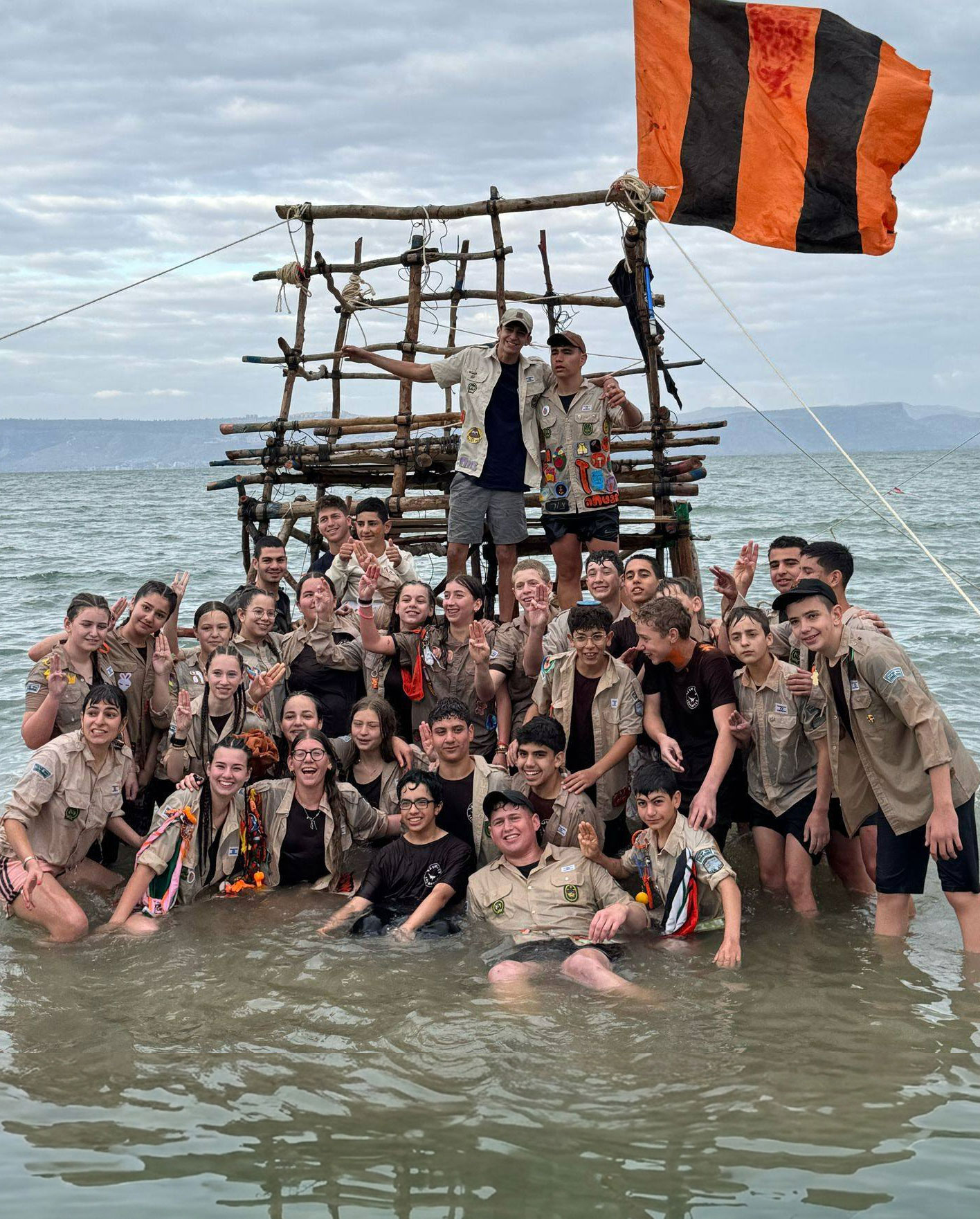 youth gathered on a built raft